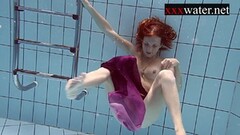 Smoking hot redhead naked in the pool Thumb