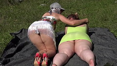 Mature lesbian with a strapon fucks a fat  girlfriend outdoors in a public park. Two big asses in na Thumb