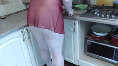 MILF Frina continues naked cooking. Todays menu is chicken. Sexy Milf in kitchen no panties in trans Thumb