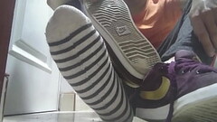 Red sneakers and sweaty socks after a long day Thumb