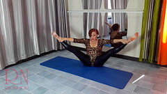 Regina Noir. A woman in a leopard bodysuit and latex leggings is doing yoga in the gym. Yoga in sexy Thumb