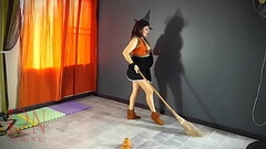 HALLOWEEN 2021 Witch in a sexy red suit. Red-haired witch with pumpkins and a broom. Regina Noir Bac Thumb