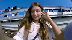 Talia Mint plays in public with remote control toy over the phone with fan Thumb