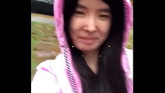 Asian Teen publicly reveals herself in the rain! Thumb