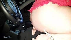 BS010619  003115 SV Katya is driving  her car wearing her red mini skirt and  using her slave as a h Thumb