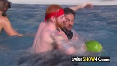 A horny group of swingers is having fun playing naked in the water. Thumb