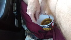 Naked Driver recycles his piss in the car Thumb