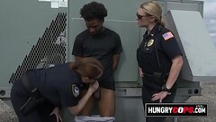 Black criminal is apprehended by two big titty MILFs. Thumb