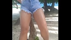Horny asian girl peeing her pants on tropical island! Thumb