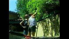Open-handed gardener is not against to share his hard tool with his assistant Thumb