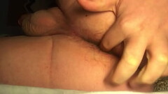 Young bottom playing with his hole Thumb