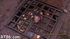 Caged cutie removes her charming clothings in captivity Thumb