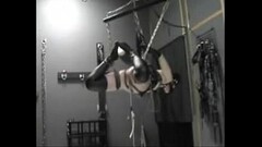 suspended slave girl in rubber Thumb